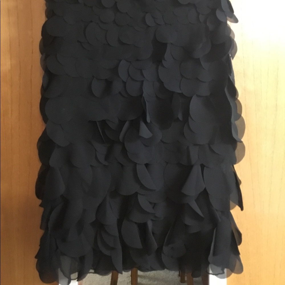 Paniz Size 6 Black skirt Playful texture, fully lined.